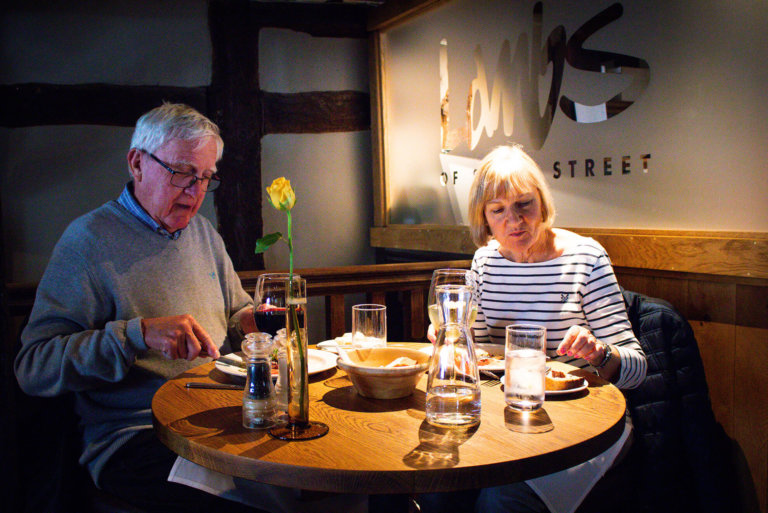 A happy couple enjoying their meal at Lambs Restaurant